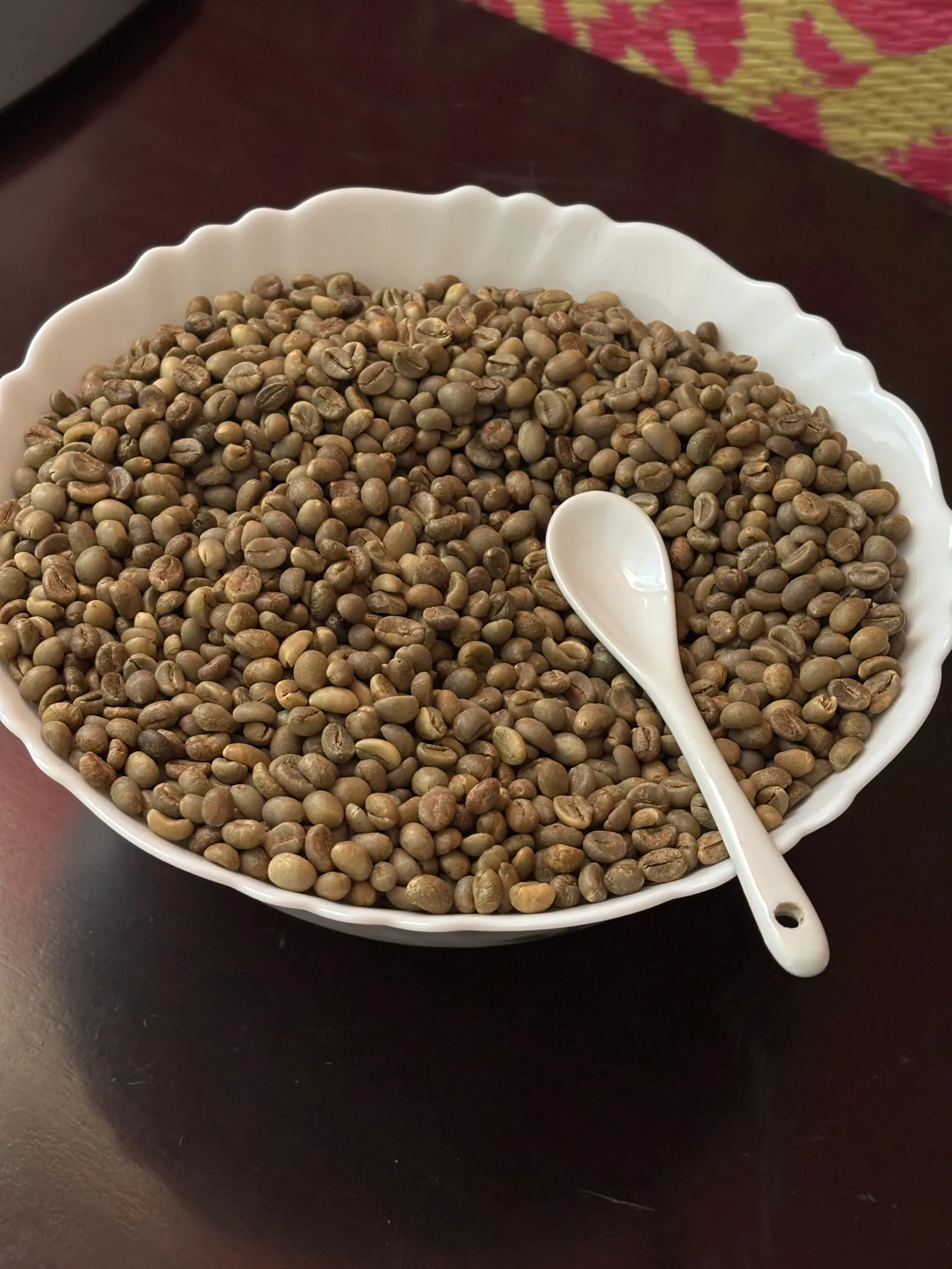 A bowl of raw green coffee beans from Halflong, Assam